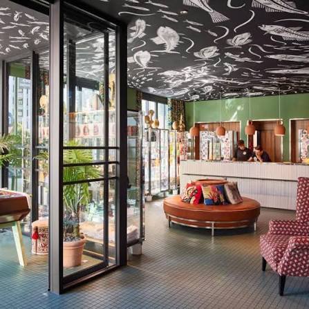 Mama Shelter Lisbon lobby with signature illustrated ceiling