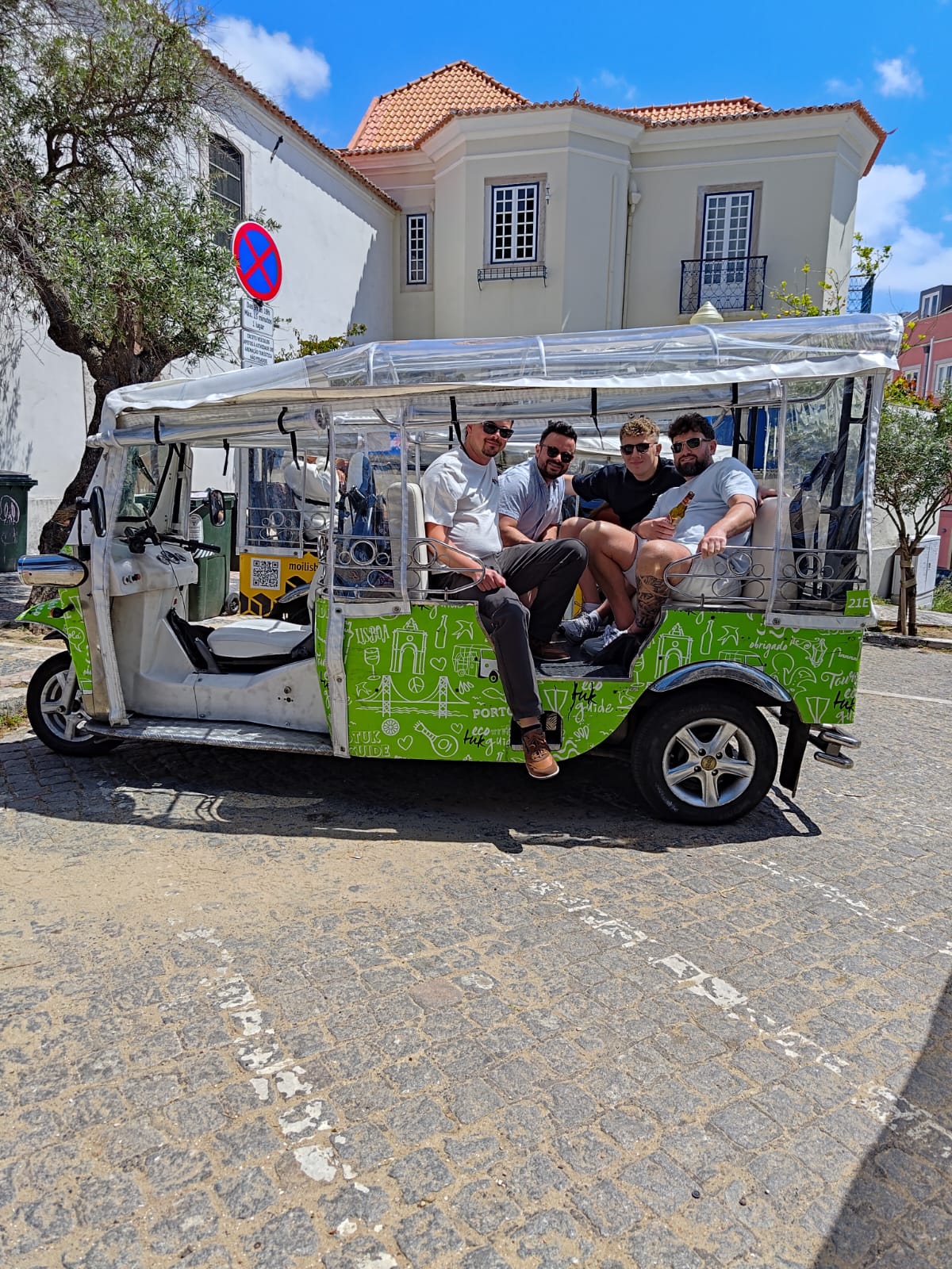 Attendees enjoying a city tuk-tuk tour of Lisbon