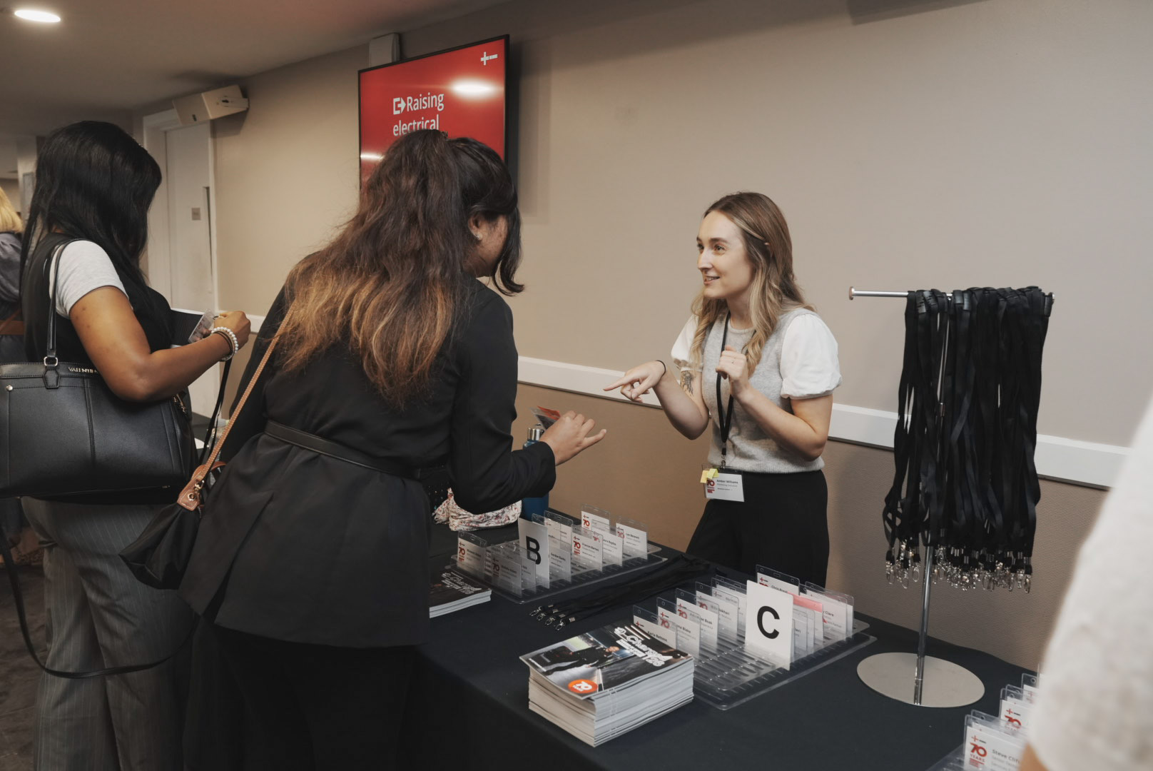 Delegate registration desk with name badges and lanyards