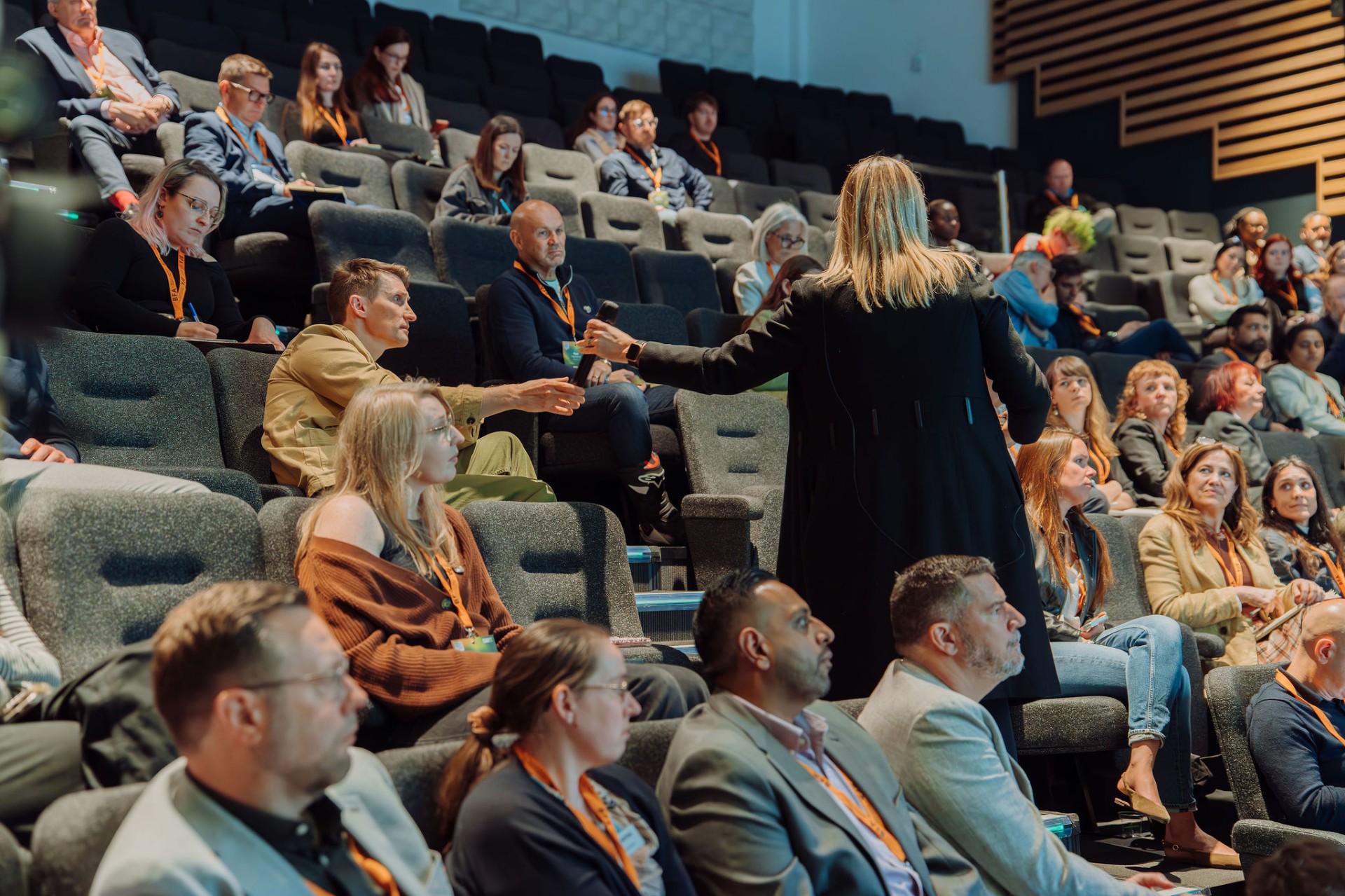 Engaged audience taking part in the summit session