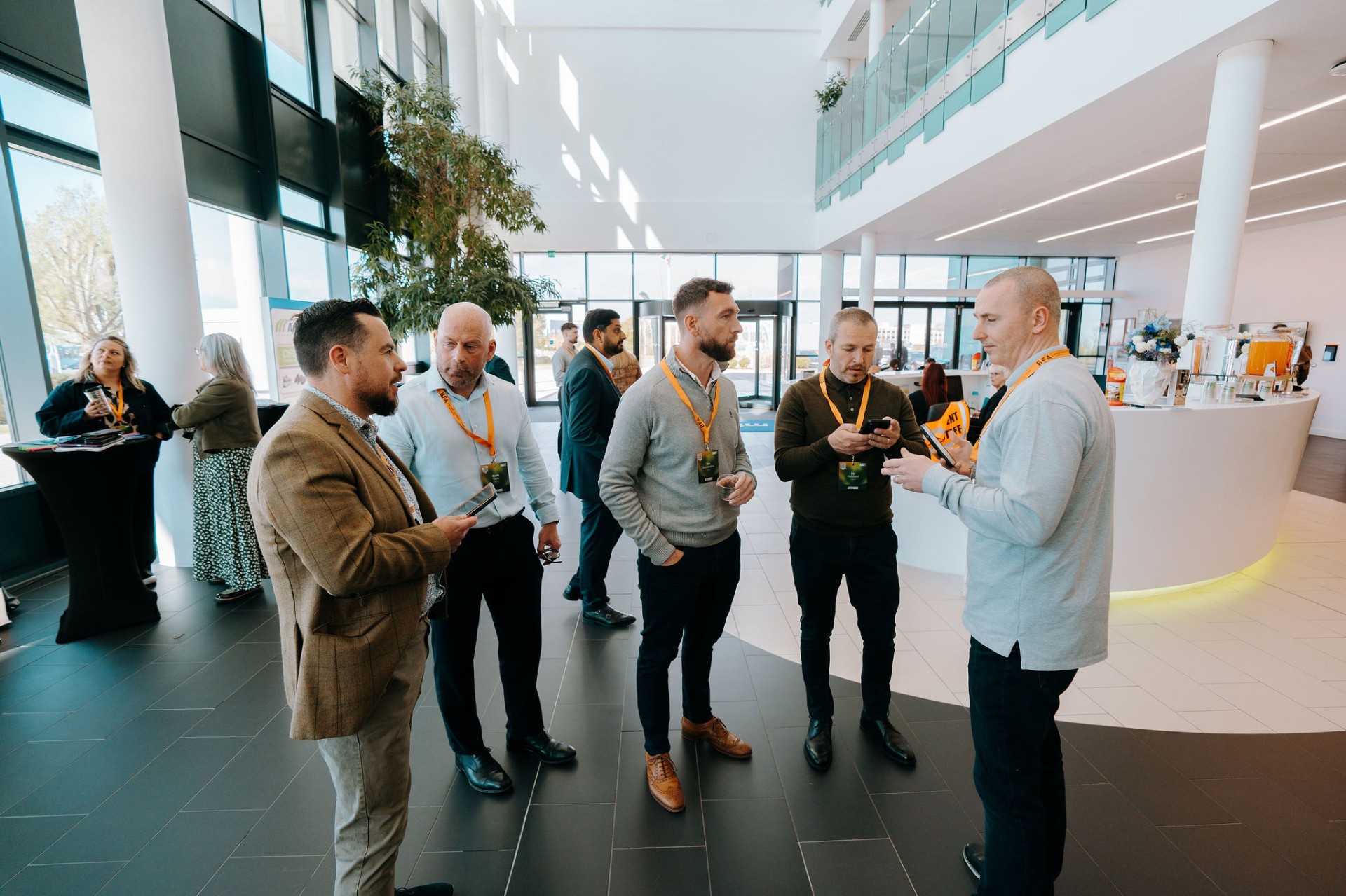 Delegates networking in the venue lobby on arrival