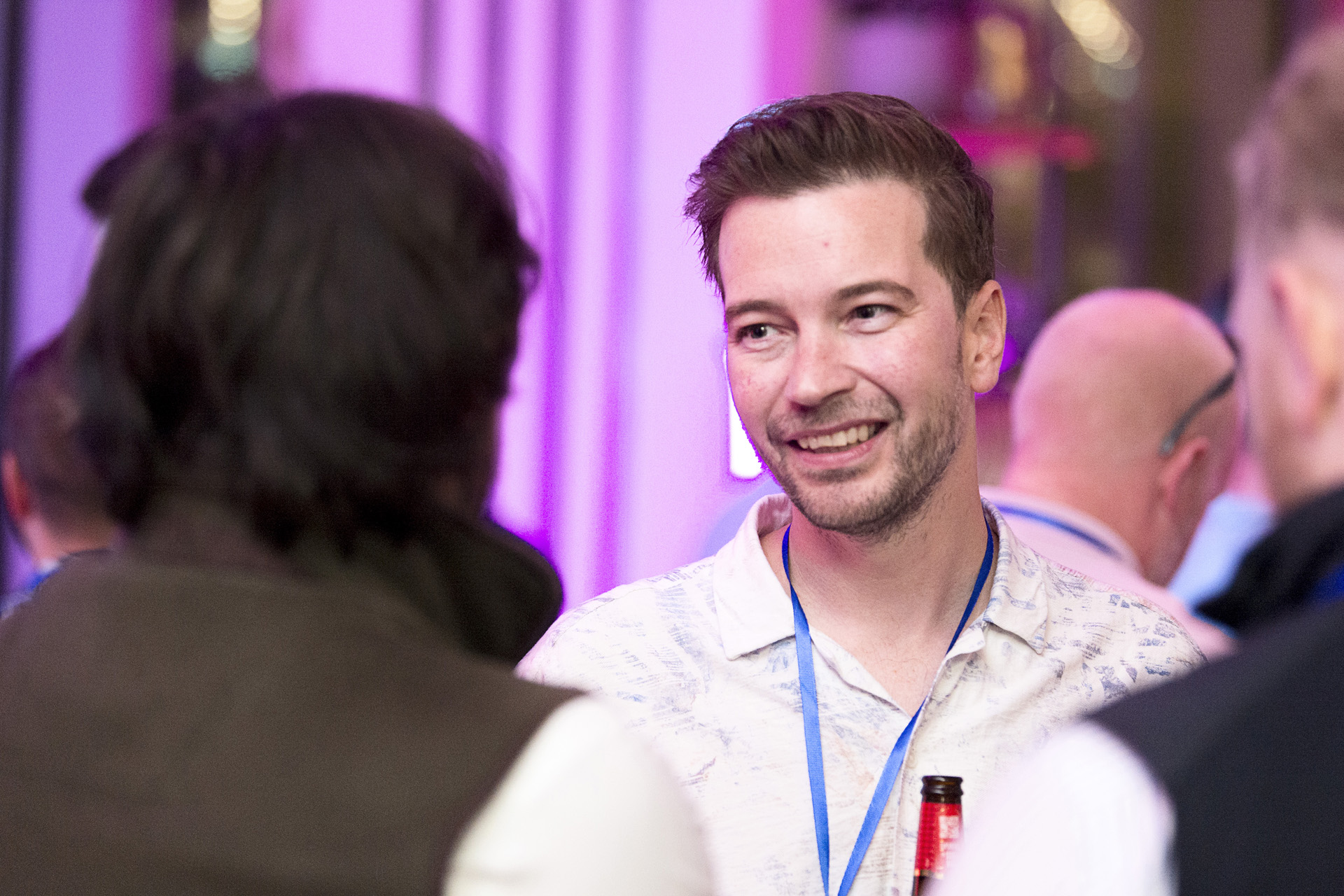 Guests networking at the summer party