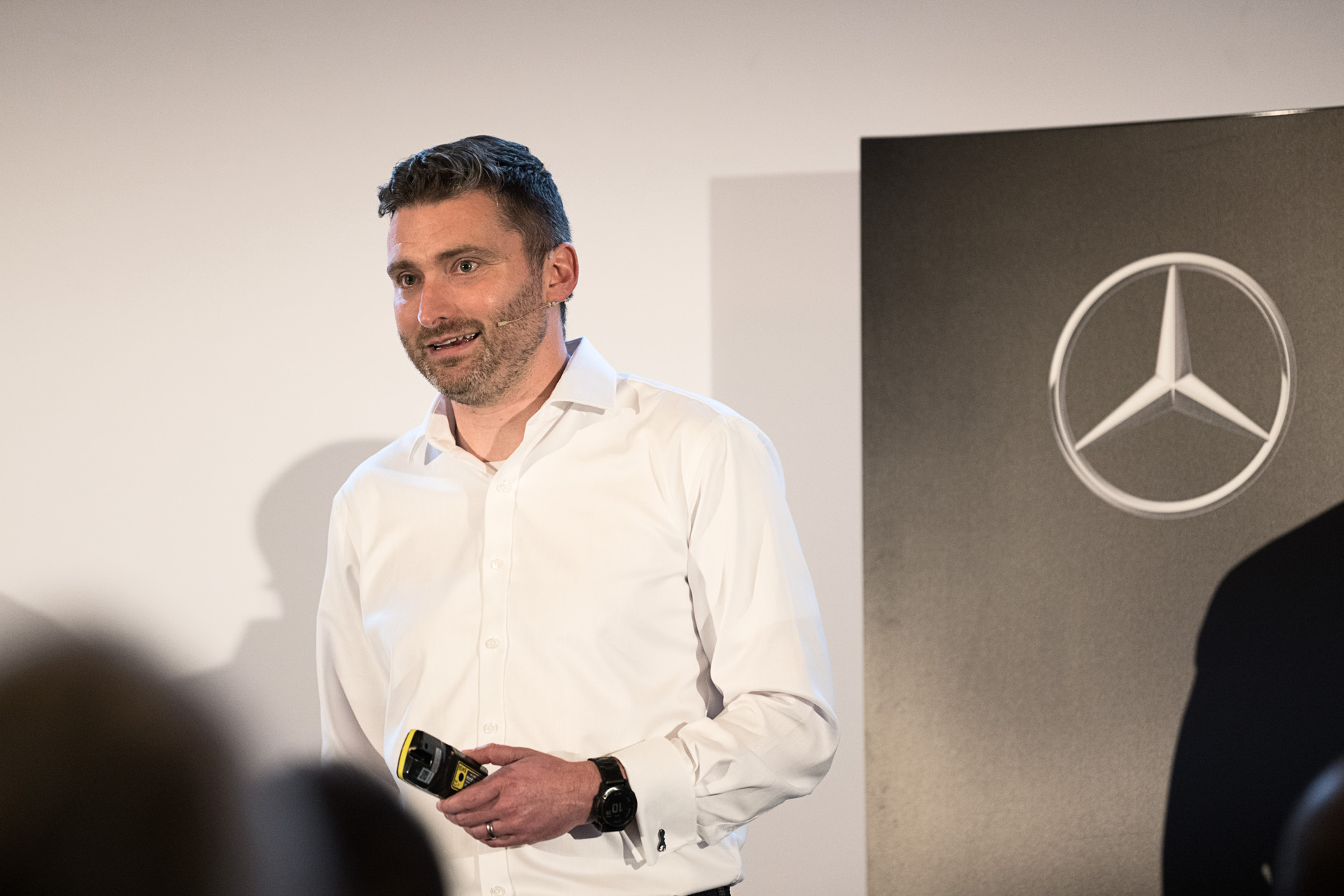 Speaker presenting on the Mercedes-Benz Trucks stage